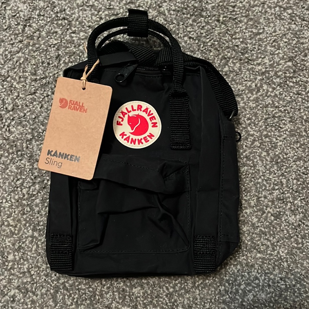 This is a brand new black Flallraven sling backpack in perfect condition